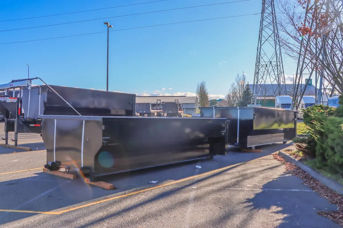 Roll-off dumpster ready for waste disposal at job site for 2 Yard Dumpster Rental in Newton